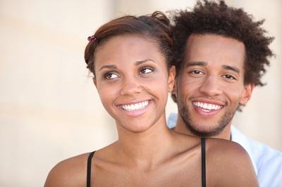Young couple smiling together l Tooth-Colored Fillings Azalea Dental