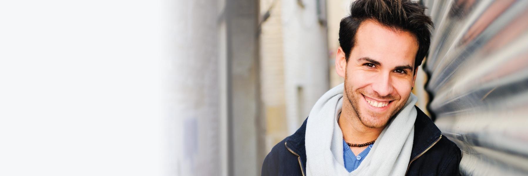 Young man smiling l Peridontal Disease Treatment Azalea Dental